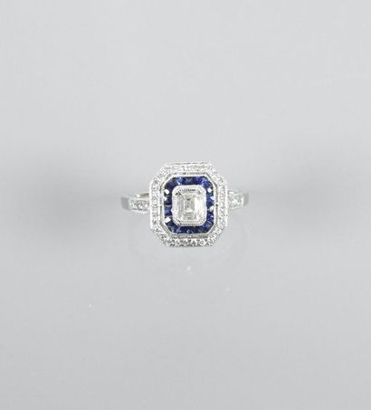 null Ring in white gold, 750 MM, centered on an emerald cut diamond weighing about...