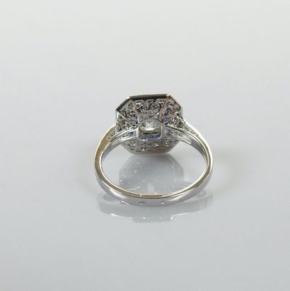 null Ring in white gold, 750 MM, centered on an emerald cut diamond weighing about...