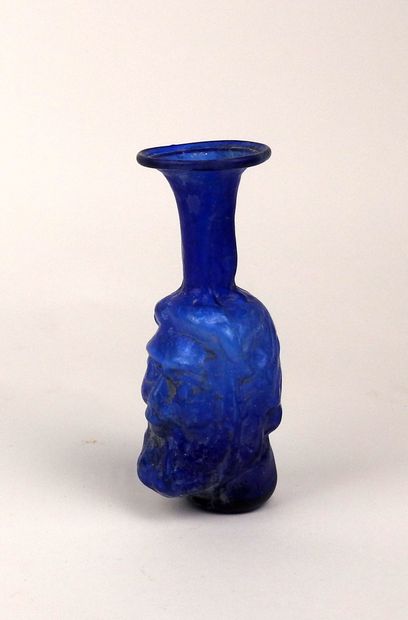 null Anthropomorphic bottle representing a bearded man

Coloured glass 14 cm

Roman...