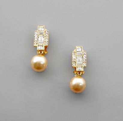 DIOR, Golden ear clips decorated with rhinestones...