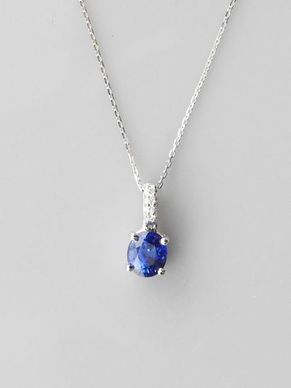 null Diamond chain and pendant in white gold, 750 MM, set with an oval sapphire weighing...