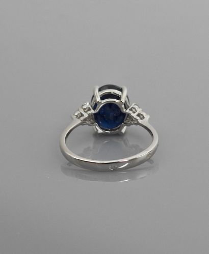 null Ring in white gold, 750 MM, set with an oval sapphire weighing 4.50 carats between...