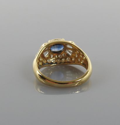 null Beautiful Dome ring in yellow gold, 750 MM, centered of an oval sapphire shouldered...