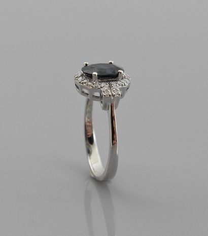 null Ring in white gold, 750 MM, set with an oval sapphire weighing 1.40 carat, shouldered...