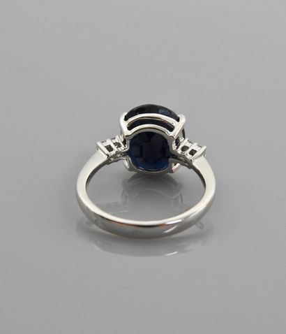 null Ring in white gold, 750 MM, set with an oval sapphire weighing approximately...