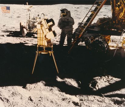 NASA NASA. Apollo 16. Astronaut John W. Young stands in the shadow of the lunar module...