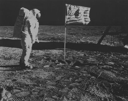 NASA NASA. Apollo 11. Astronaut Buzz Aldrin poses in front of the American flag unfurled...