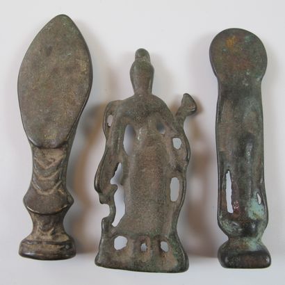 null Three domestic altar statuettes representing Buddhist deities. Bronze with dark...