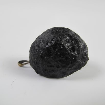 null Tectite called tear of the earth mounted in pendant. Impactite (silicates)....