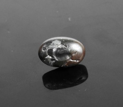 null Intaglio representing an animal, probably an antelope

Black veined stone 1.5...