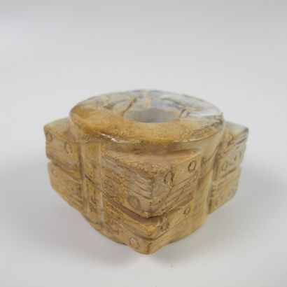 null Small jade cone with two registers of superimposed stylized masks. Calcified...