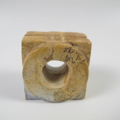 null Small jade cone with two registers of superimposed stylized masks. Calcified...