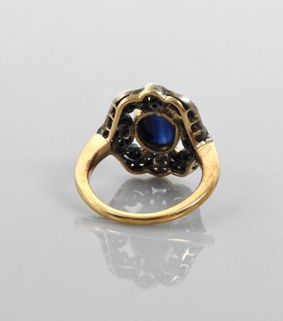 null Ring in gold 750MM and silver 925 MM, centered of a cabochon sapphire in setting...