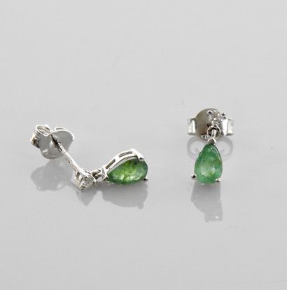 null Small earrings in white gold, each adorned with a diamond above a pear-cut emerald,...