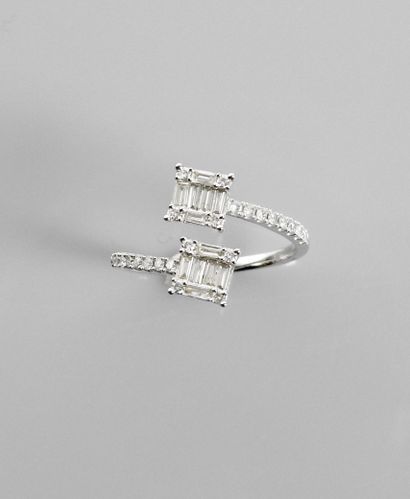 null Open ring in white gold, 750 MM, showing two motifs covered and worn by diamonds...