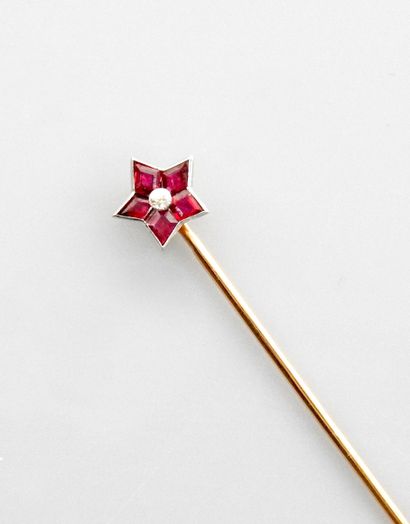 null Long pink gold tie pin, 750 MM, punctuated with a star set with rubies around...