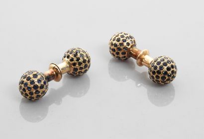 null 
Pair of cufflinks each forming two yellow gold beads, 375 MM, covered with...