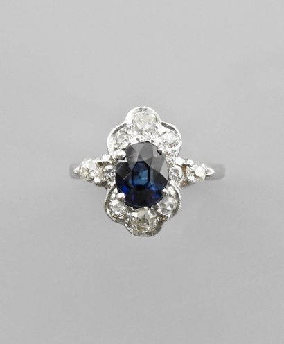 null White gold ring, 750 MM, set with an oval sapphire weighing 2.20 carats in a...