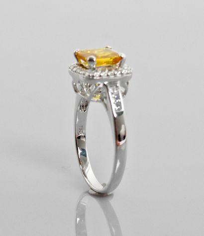 null White gold ring, 750 MM, set with a treated yellow sapphire weighing approximately...