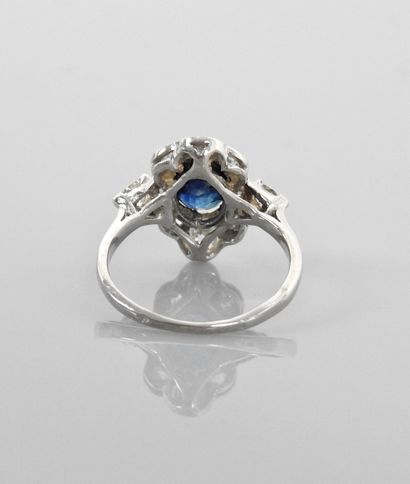 null White gold ring, 750 MM, set with an oval sapphire weighing 2.20 carats in a...