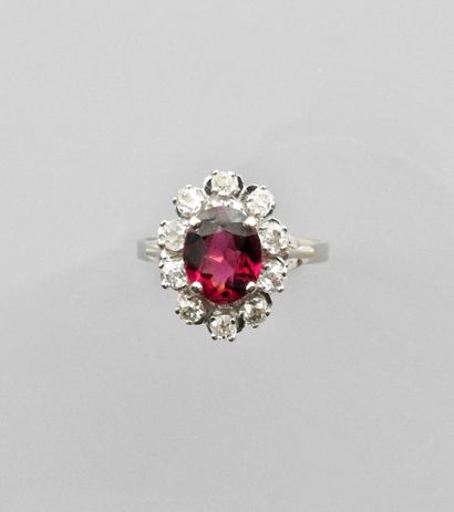 null Ring in two golds, 750 MM, centered on an oval pink tourmaline surrounded by...