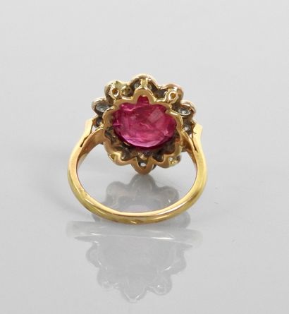 null Yellow gold ring, set with an oval ruby weighing approximately 5 carats within...