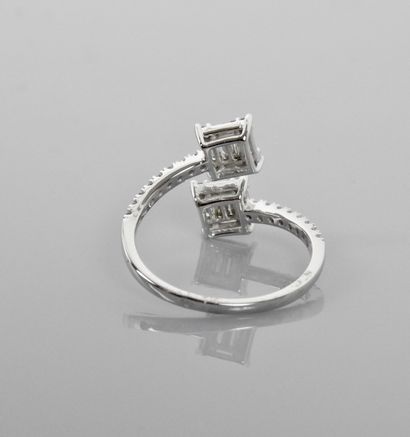 null Open ring in white gold, 750 MM, showing two motifs covered and worn by diamonds...