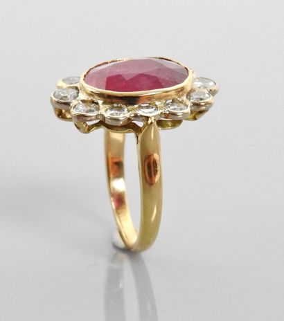 null Yellow gold ring, set with an oval ruby weighing approximately 5 carats within...
