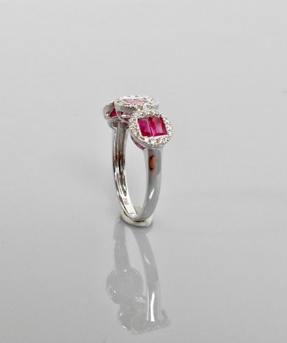 null Ring with three designs in white gold, 750 MM, set with calibrated rubies surrounded...