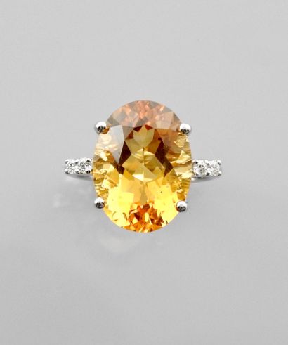 null White gold ring, 750 MM, set with an oval citrine weighing about 9 carats, 15...