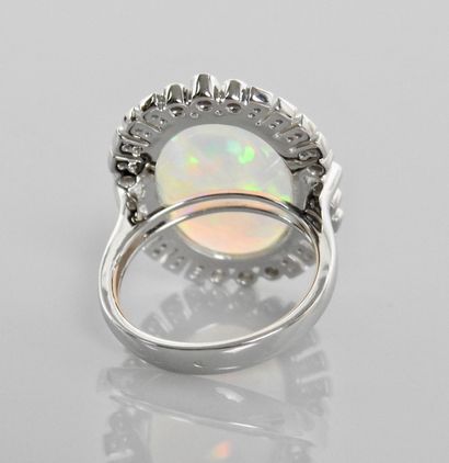 null Pretty flat ring in white gold, 750 MM, set with an opal weighing 6 carats approximately...
