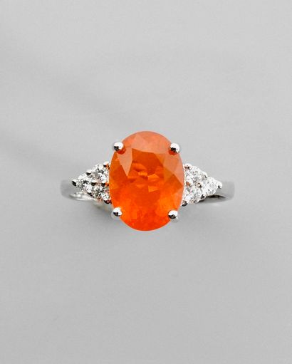null White gold ring, 750 MM, set with an oval fire opal weighing about 2.50 carats,...