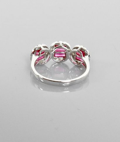 null Ring with three designs in white gold, 750 MM, set with calibrated rubies surrounded...