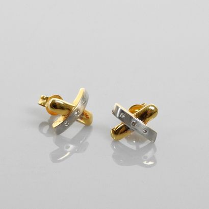 null Earrings, two gold, 750 MM, each punctuated with three diamonds, weight: 3.4gr....