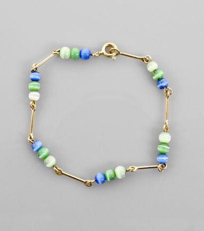 null Bracelet of yellow gold bars, 750 MM, interspersed with small colored pearls,...