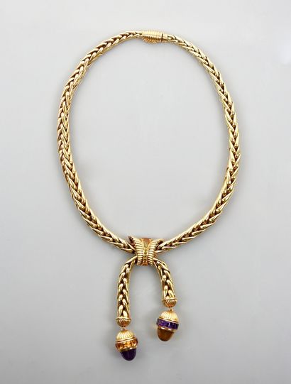 null 
CARTIER 

Yellow gold necklace, 750 mm, holding two tassels with calibrated...