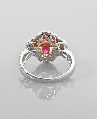 null Ring in white gold, 750 MM, set with four rubies surrounded by baguette and...