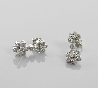 null Earrings in white gold, 750 MM, each drawing two flowers covered with diamonds,...