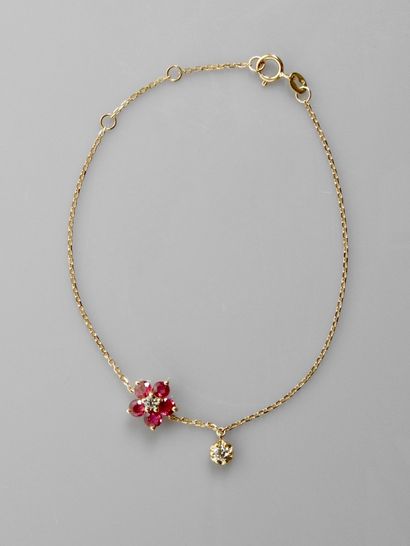 null Pink gold bracelet, 750 MM, centered on a flower decorated with a diamond and...