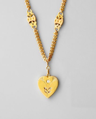 null Beautiful yellow gold necklace, 750 MM, bearing an opening heart centered with...