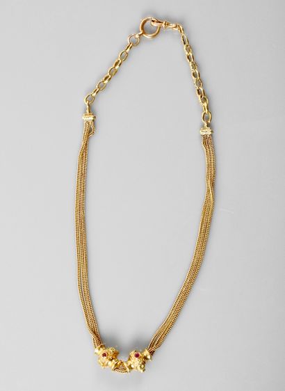 null 
Pretty chain "Giletière" braided mesh in yellow gold, 750 MM, decorated with...