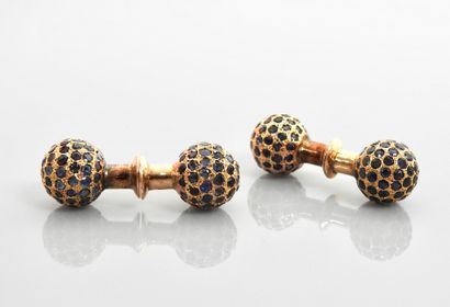 null 
Pair of cufflinks each forming two yellow gold beads, 375 MM, covered with...