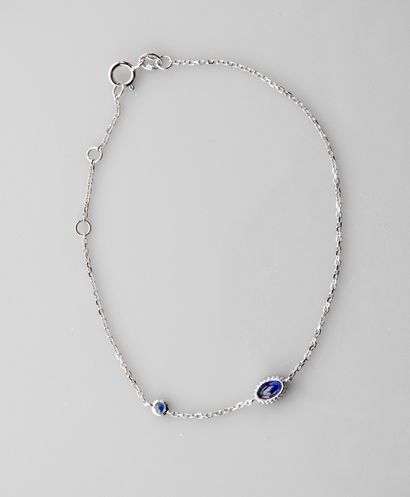 null Bracelet in white gold, 750 MM, decorated with two oval sapphires, spring ring...