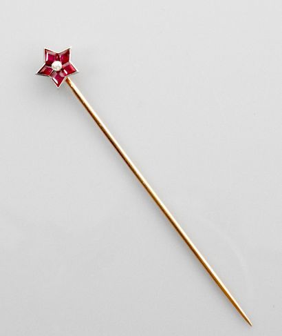 null Long pink gold tie pin, 750 MM, punctuated with a star set with rubies around...