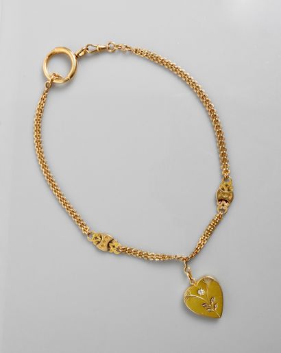 null Joli collier d'or jaune, 750 MM, portant un coeur ouvrant centré d'un diamant,...