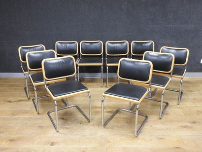 null Suite of ten chairs in chromed steel tubes, cantilevered legs covered with black...