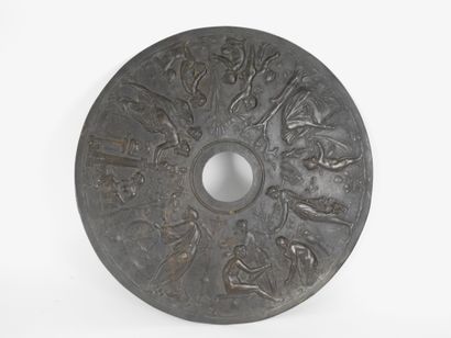 null Orbicular disc decorated with antique scenes in relief

Bronze

19th century

L...