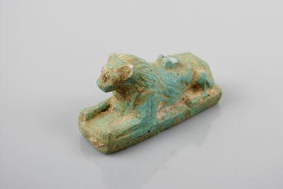 null A Ptolemaic style amulet of a reclining lion, symbol of the king, guardian and...
