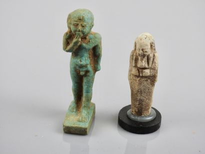 null Two amulets including God

Harpocrates and oushebti, frit or glass paste, Low...