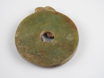 null Bi disc with dragons.

Nephrite jade.fine old work.probably Ming or Qing period.l...